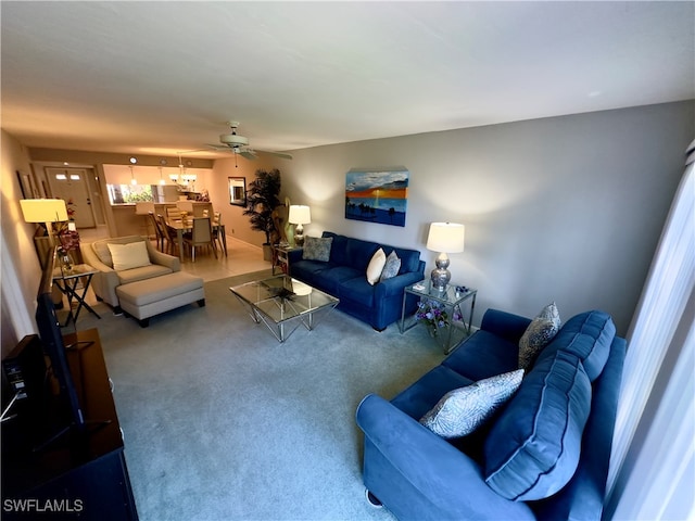 carpeted living room featuring ceiling fan