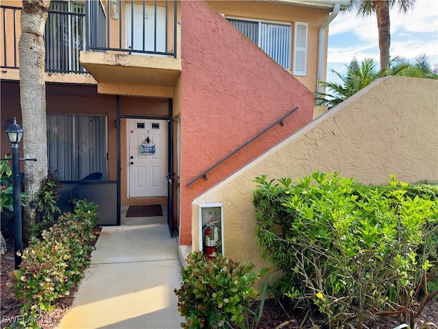 property entrance with a balcony