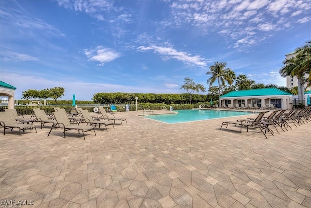 4141 Bay Beach Ln Unit 454, Fort Myers Beach, FL 33931 - community pool featuring a patio