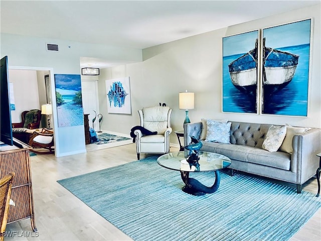 living room with light hardwood / wood-style floors