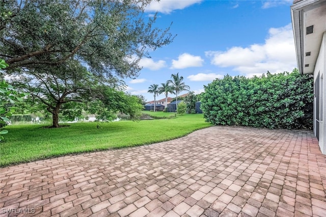 view of patio featuring a water view