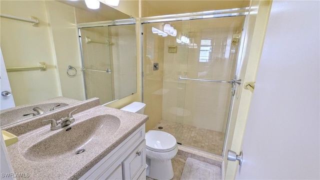 full bath featuring toilet, a shower stall, and vanity