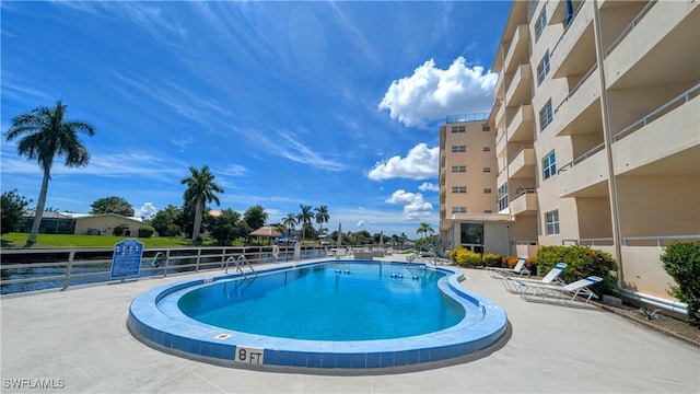 pool featuring a patio area