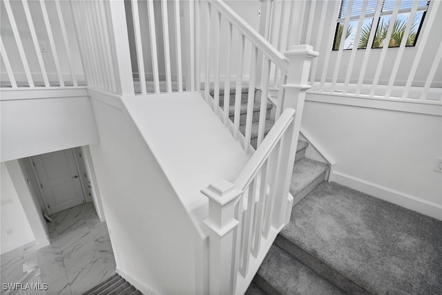 staircase with carpet floors