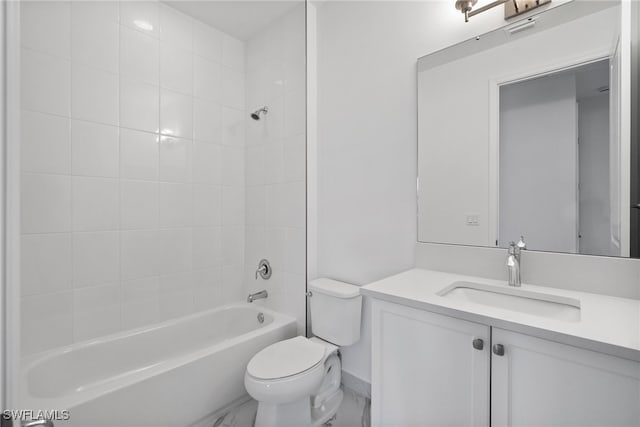 full bathroom with vanity, toilet, and tiled shower / bath