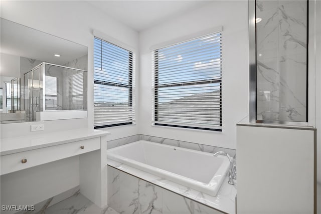 bathroom featuring vanity and separate shower and tub