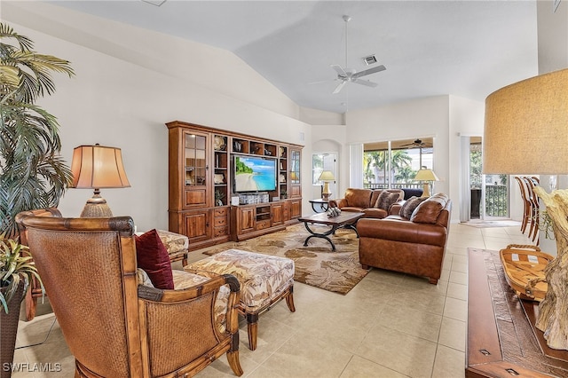 living room featuring lofted ceiling, light tile patterned floors, and ceiling fan