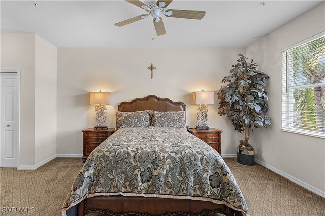 bedroom with carpet, ceiling fan, and a closet