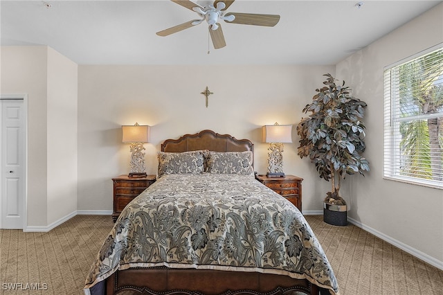 bedroom featuring baseboards, carpet floors, and ceiling fan