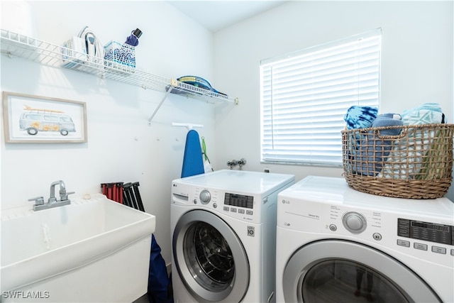 laundry room with washing machine and dryer and sink