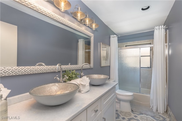 full bathroom with vanity, toilet, shower / bath combination with curtain, and tile patterned floors