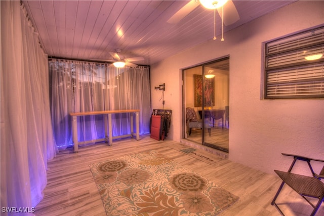 interior space with hardwood / wood-style floors and ceiling fan