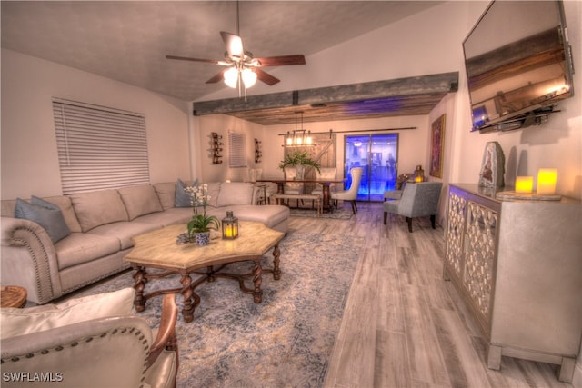 living room with lofted ceiling, hardwood / wood-style floors, and ceiling fan