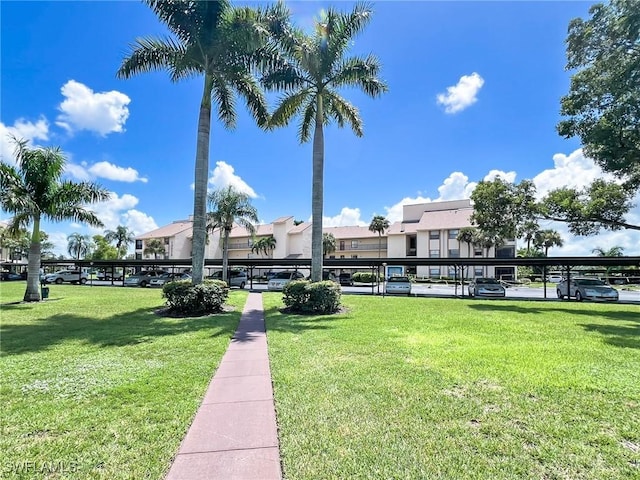 view of home's community featuring a lawn