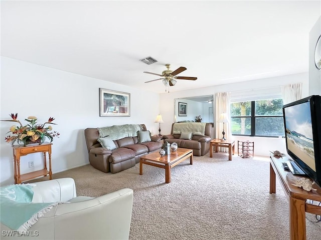 living room featuring carpet and ceiling fan