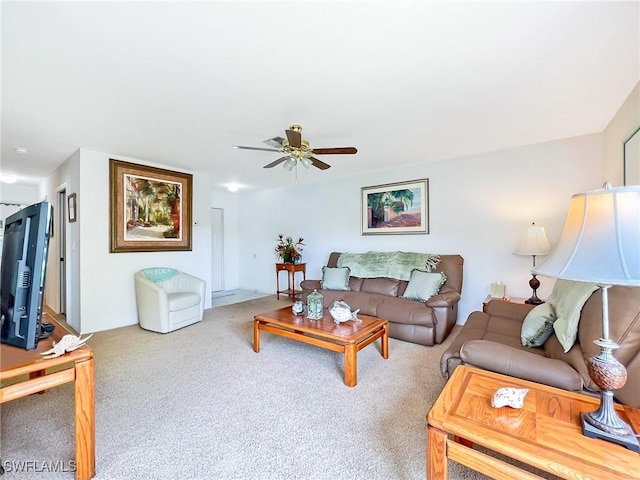 carpeted living room featuring ceiling fan