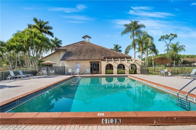 view of swimming pool with a patio area