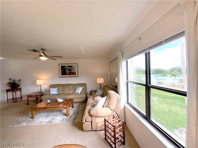 13276 White Marsh Ln Unit 3522, Fort Myers, FL 33912 - carpeted living area with visible vents, a water view, ceiling fan, and a healthy amount of sunlight