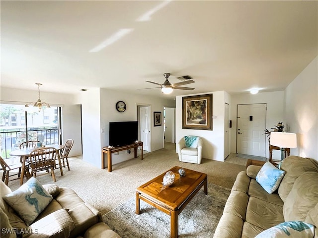 13276 White Marsh Ln Unit 3522, Fort Myers, FL 33912 - living room with light colored carpet, visible vents, and ceiling fan with notable chandelier