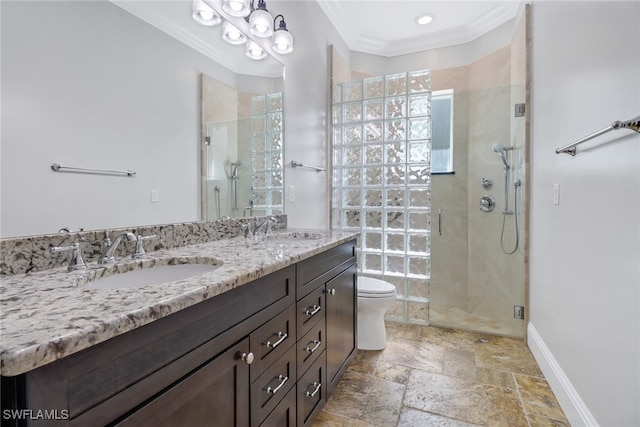 bathroom with toilet, ornamental molding, walk in shower, and vanity