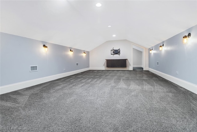 unfurnished living room with lofted ceiling and carpet flooring