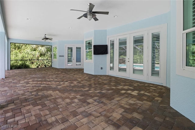 view of patio with french doors and ceiling fan