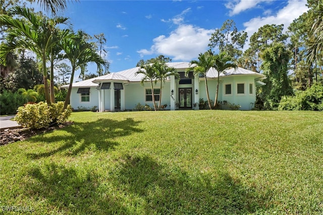 single story home featuring a front yard