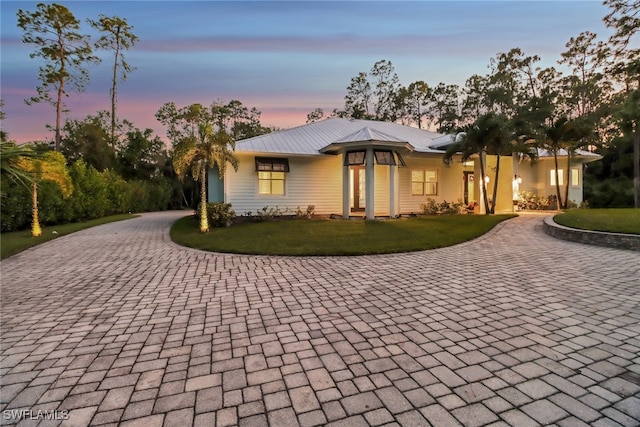 view of front of house with a yard