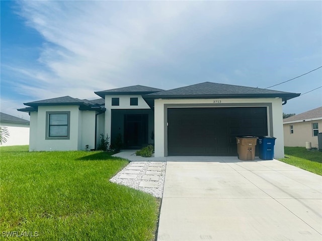 3713 25th St SW, Lehigh Acres, FL 33976 - prairie-style home with an attached garage, concrete driveway, a front yard, and stucco siding