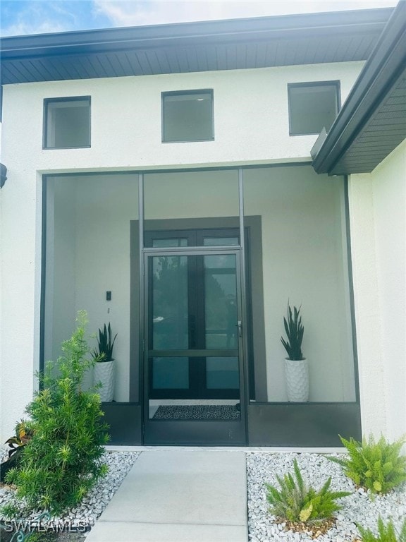 3713 25th St SW, Lehigh Acres, FL 33976 - property entrance with stucco siding