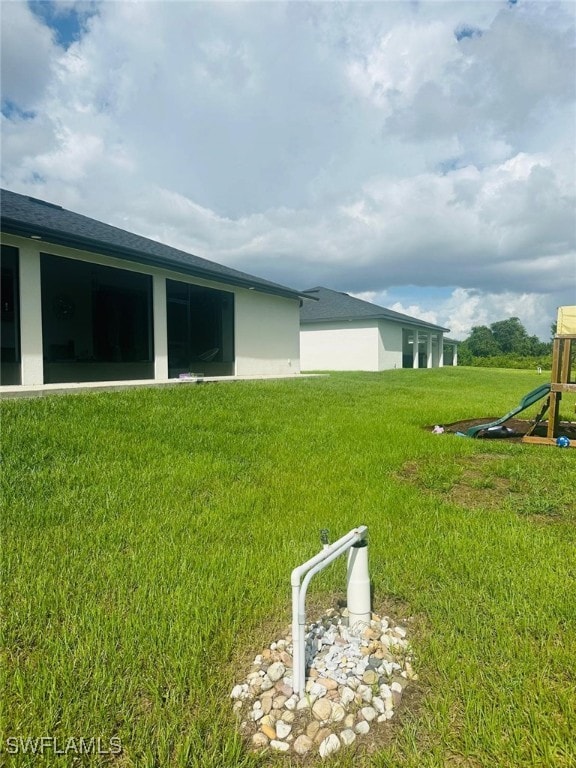 3713 25th St SW, Lehigh Acres, FL 33976 - view of yard with a playground
