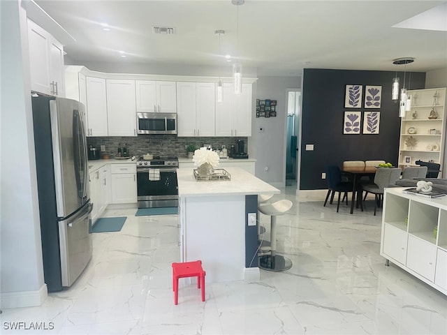 3713 25th St SW, Lehigh Acres, FL 33976 - kitchen featuring visible vents, backsplash, appliances with stainless steel finishes, and marble finish floor