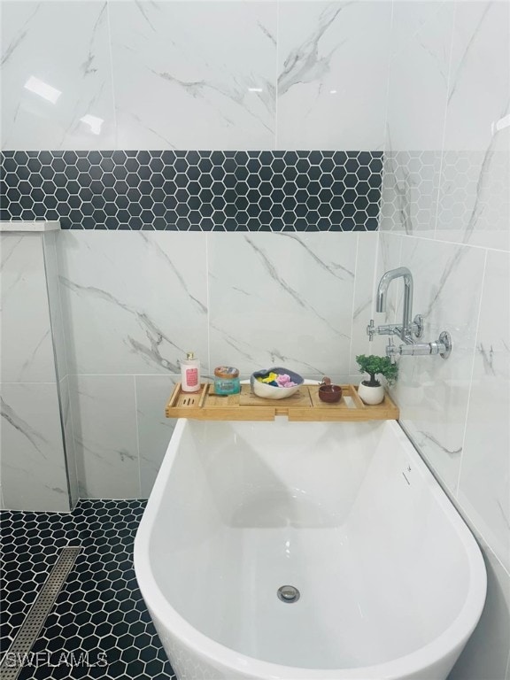 bathroom featuring a tub and tile patterned floors