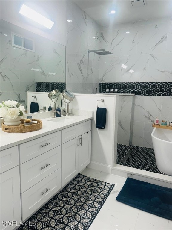 3713 25th St SW, Lehigh Acres, FL 33976 - bathroom featuring a soaking tub, a sink, double vanity, a marble finish shower, and marble finish floor