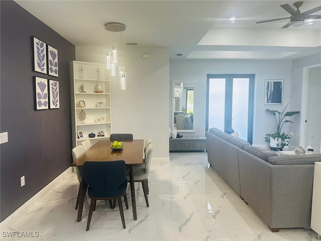 dining space featuring ceiling fan