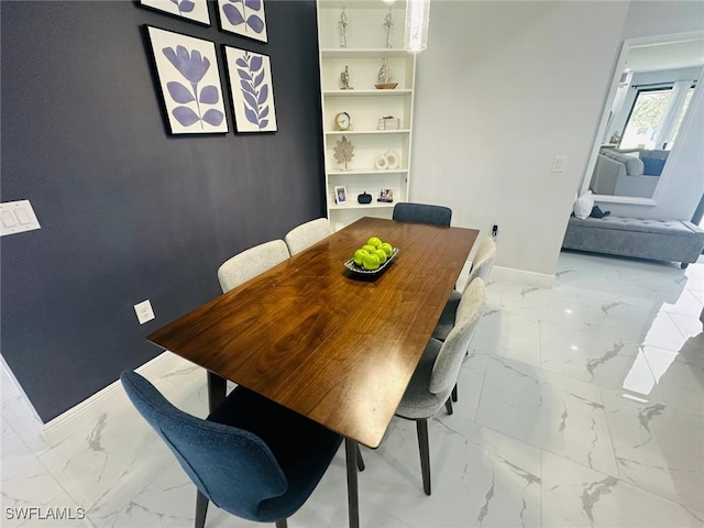 3713 25th St SW, Lehigh Acres, FL 33976 - dining space with marble finish floor and baseboards