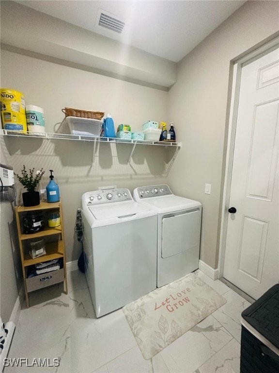 washroom featuring washer and dryer