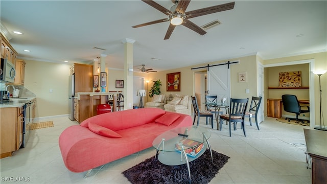 living room with ceiling fan, sink, ornamental molding, and a barn door