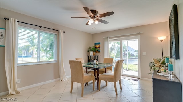 tiled dining area featuring ceiling fan and a healthy amount of sunlight