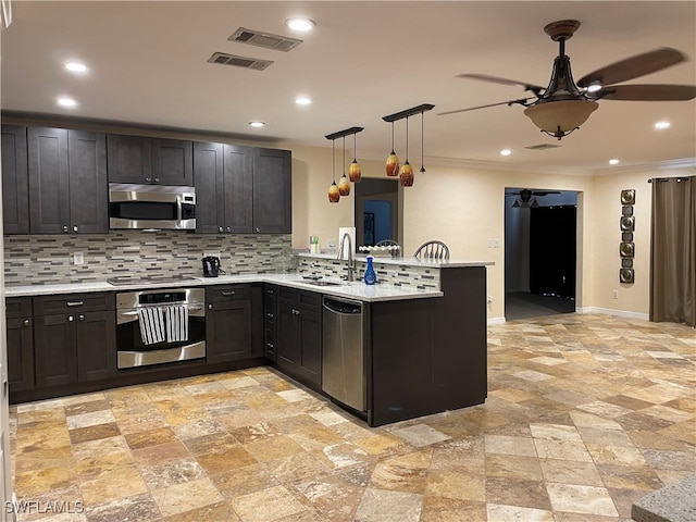 kitchen with pendant lighting, stainless steel appliances, kitchen peninsula, and ceiling fan