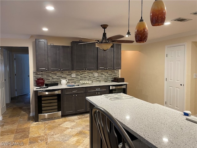 kitchen featuring crown molding, backsplash, wine cooler, and ceiling fan