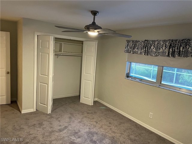 unfurnished bedroom with a closet, ceiling fan, and carpet floors