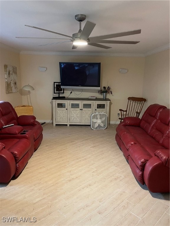 living room with ornamental molding, light hardwood / wood-style flooring, and ceiling fan