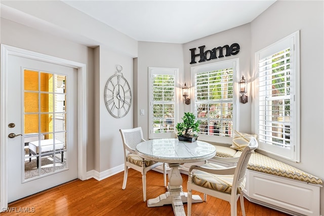 dining space featuring hardwood / wood-style flooring