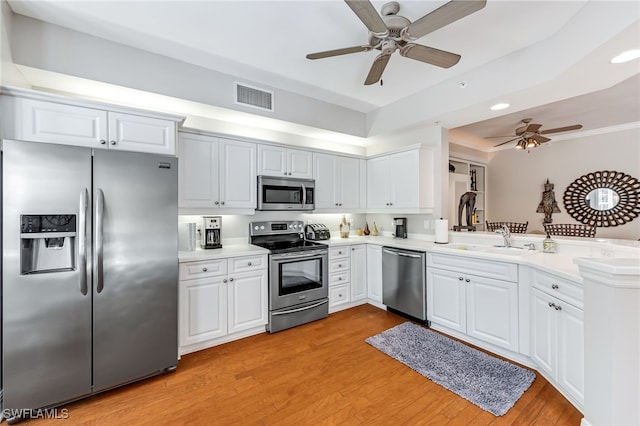 kitchen with white cabinets, ceiling fan, stainless steel appliances, and sink