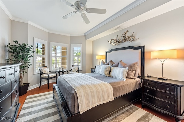 bedroom featuring ceiling fan, ornamental molding, and wood-type flooring