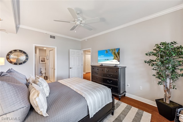 bedroom featuring crown molding, ceiling fan, dark hardwood / wood-style floors, and ensuite bathroom