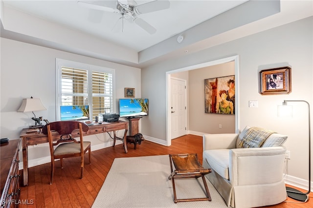 home office featuring ceiling fan and hardwood / wood-style flooring