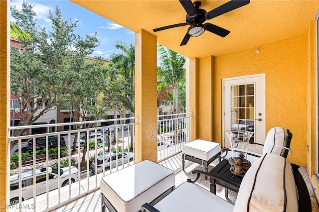 balcony with outdoor lounge area and ceiling fan