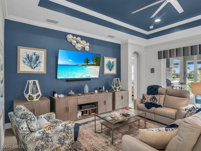 14748 Windward Ln, Naples, FL 34114 - living room featuring arched walkways, visible vents, crown molding, and ceiling fan